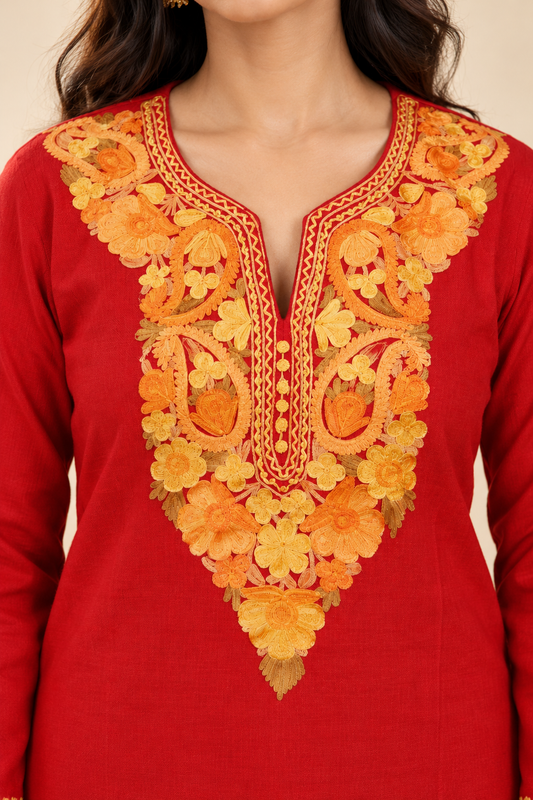 Red Aari work long kurti — close-up of the embroidered neckline
