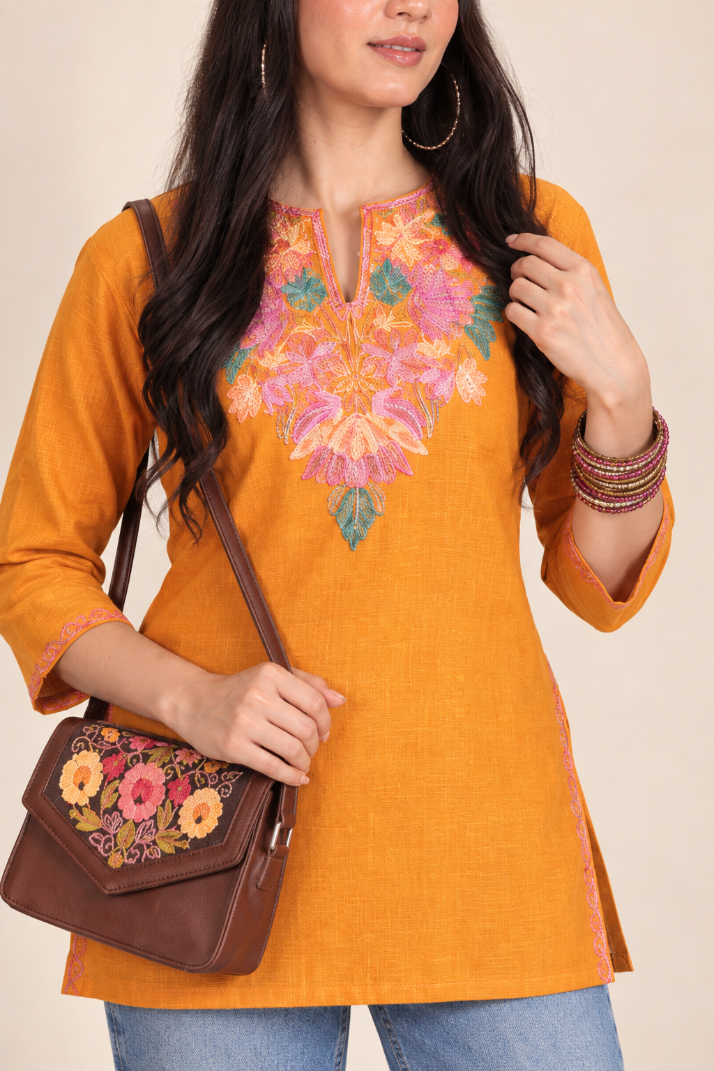 Mustard Aari work short kurti in ruby cotton — close-up of the embroidered neckline
