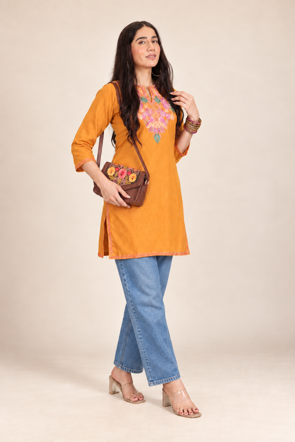Mustard Aari work short kurti in ruby cotton — model wearing it, front view