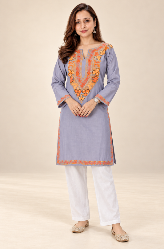 Grey and orange Aari work long kurti in ruby cotton — model wearing it, front view