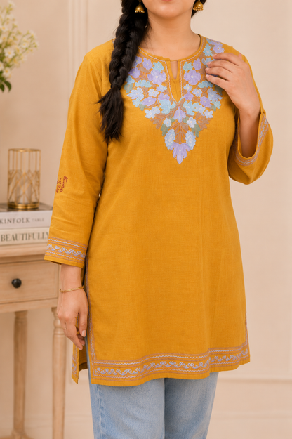 Intricately Aari Worked Ruby Cotton Short Kurti in Golden Blue